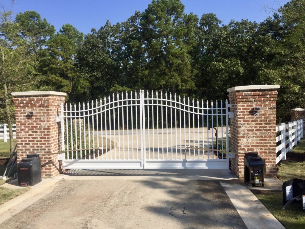 White Arched Estate Entry Gate with Brick Columns