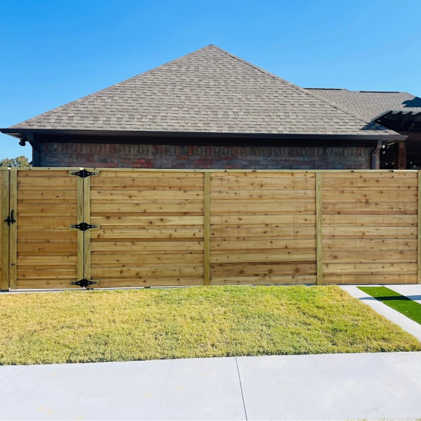 Horizontal Board on Board Fence Project in front of residential home