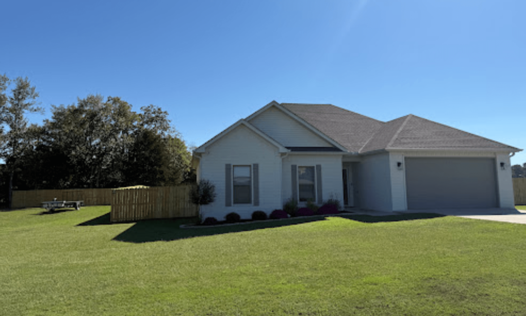 Wood Fence pictured next to client's residential home in Greenbrier